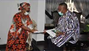 Registrar, Odisa Okeke (Mrs) making a presentation to Prof. Briggs